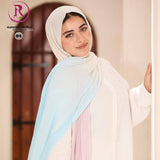 Woman wearing a light-colored scarf with a blurred background